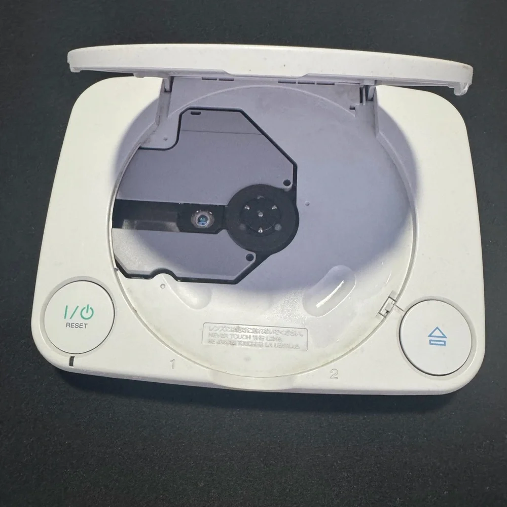 Sony PlayStation Console with Dual Gray Controllers